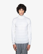 White turtleneck sweater